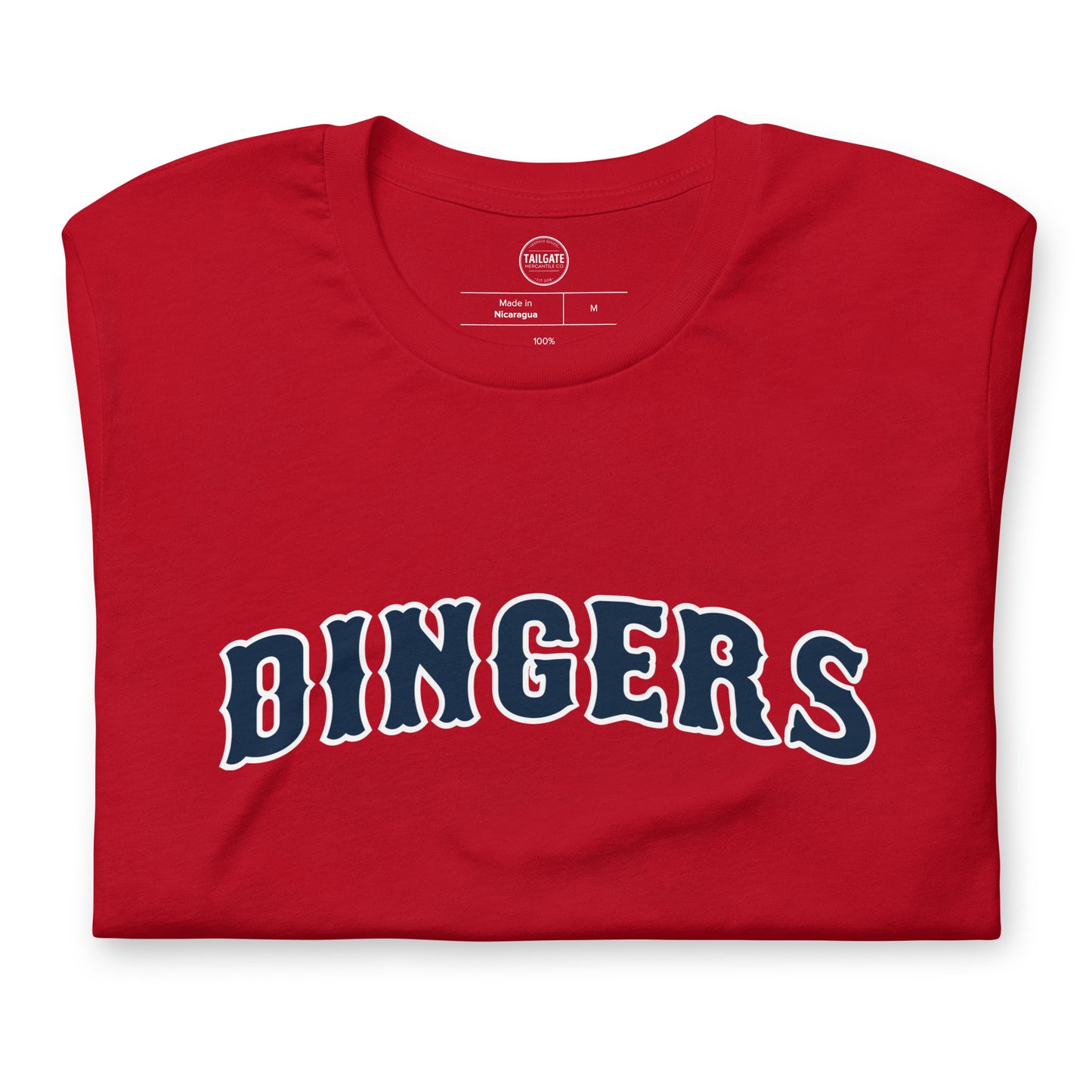 Close up image of red t-shirt with design of "DINGERS" in Boston Red Sox style font located on centre chest. This design is exclusive to Tailgate Mercantile and available only online.