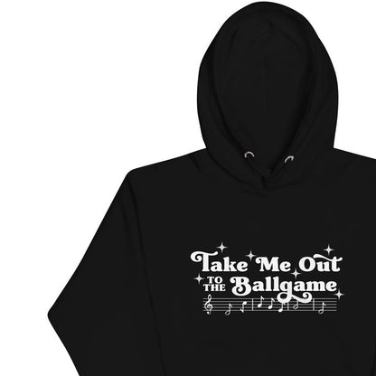 Image of black hoodie with design of "Take Me Out to the Ballgame" with coordinating musical notes in white located on centre chest. This design is exclusive to Tailgate Mercantile and available only online.