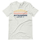 Image of heather ash t-shirt with design of "Astrodome, Houston, TX" illustrated ballpark completed in retro Houston Astros tequila sunrise colours located on centre chest. This design is exclusive to Tailgate Mercantile and available only online.