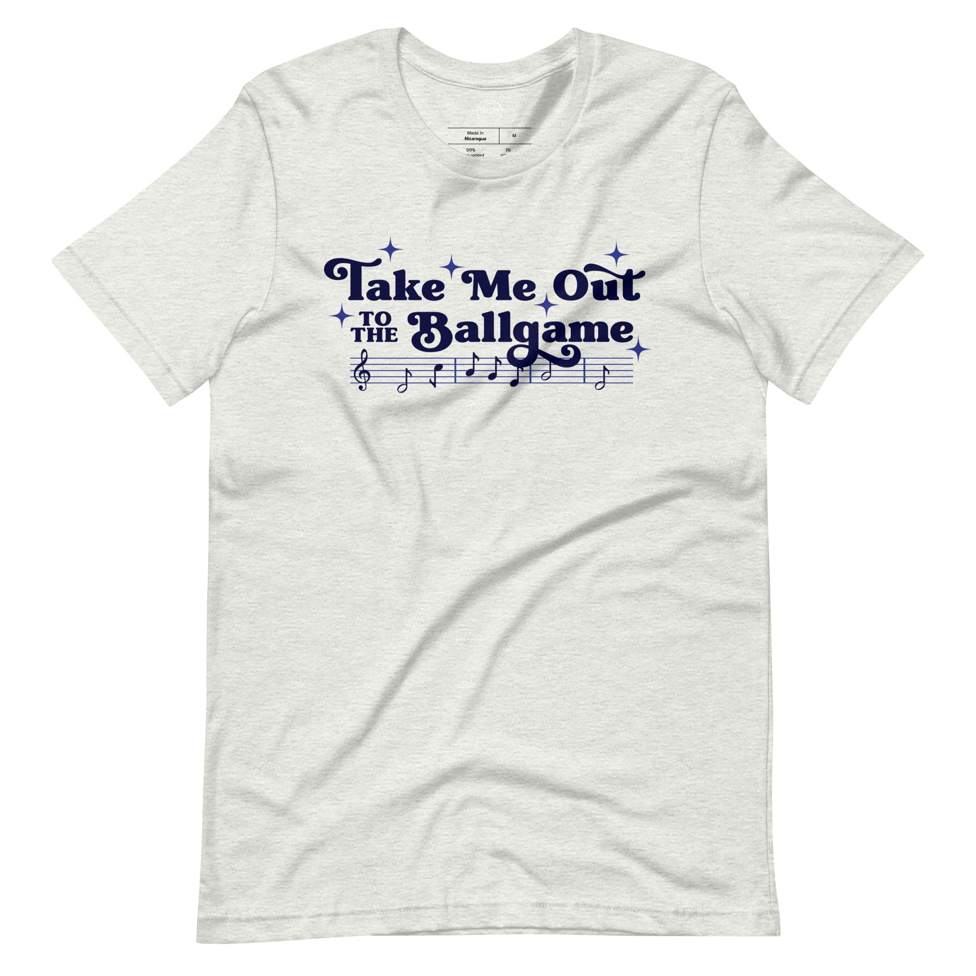 Image of heather ash t-shirt with design of "Take Me Out to the Ballgame" with coordinating musical notes in navy located on centre chest. This design is exclusive to Tailgate Mercantile and available only online.