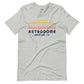 Image of heather athletic grey t-shirt with design of "Astrodome, Houston, TX" illustrated ballpark completed in retro Houston Astros tequila sunrise colours located on centre chest. This design is exclusive to Tailgate Mercantile and available only online.