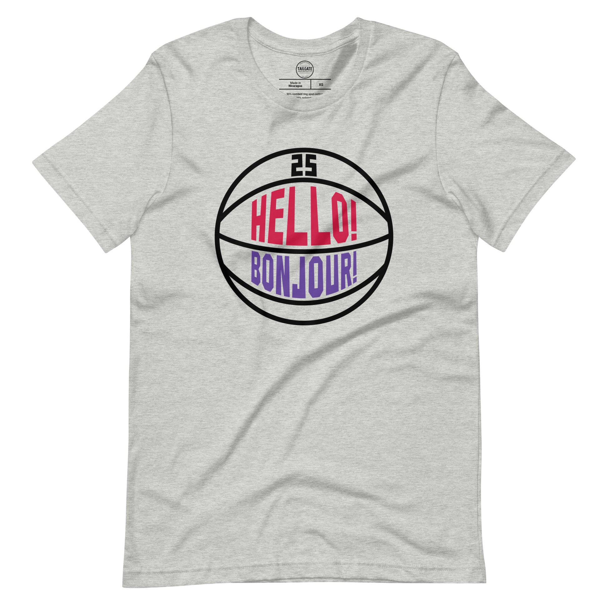 This image details the graphic design "Hello! Bonjour!". In the image, the words are built into a basketball and feature Chris Boucher's number 25. The Toronto Raptors' announcer, Jack Armstrong, loves to shout out Hello! Bonjour! when Chris Boucher does something exciting on the court. The tee is heather athletic grey and the design is black/red/purple similar to the Toronto Raptors retro colours. This item is exclusive to tailgate mercantile and is available only online.