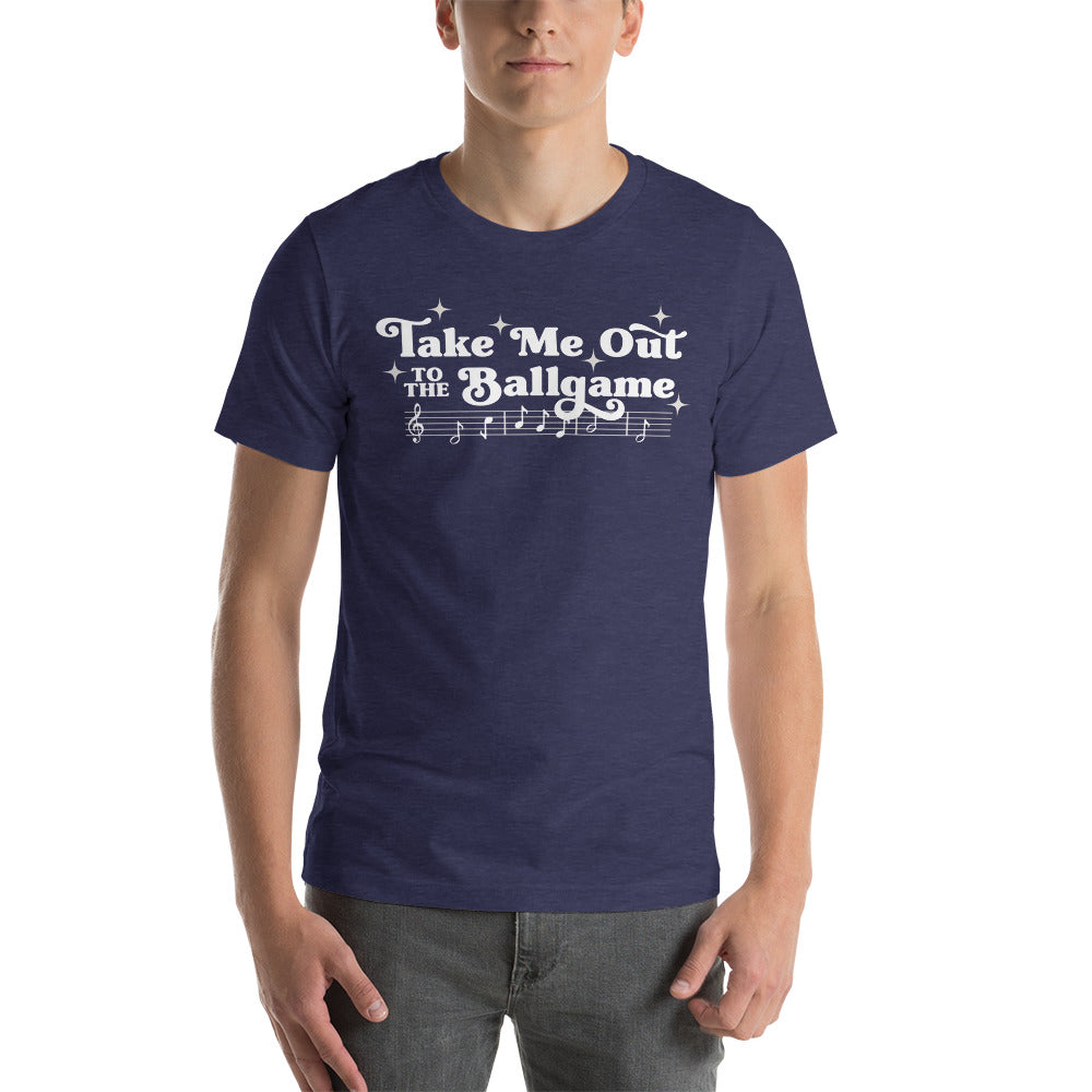 Image of man wearing heather navy t-shirt with design of "Take Me Out to the Ballgame" with coordinating musical notes in white located on centre chest. This design is exclusive to Tailgate Mercantile and available only online.