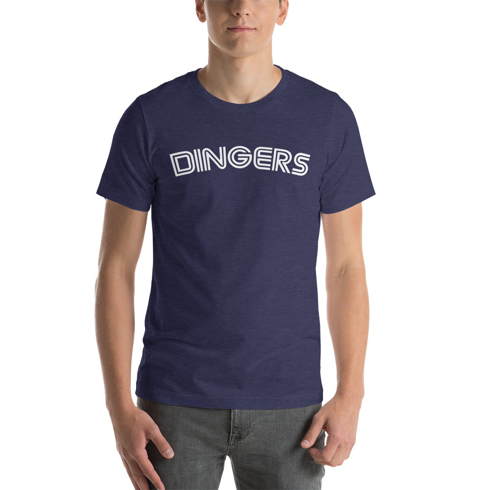 This image details the graphic design of the word "dingers" in a font similar to the Toronto Blue Jays. The font is in white and the tee is navy blue and is modelled by a young man. This design is exclusive to tailgate mercantile and available only online.