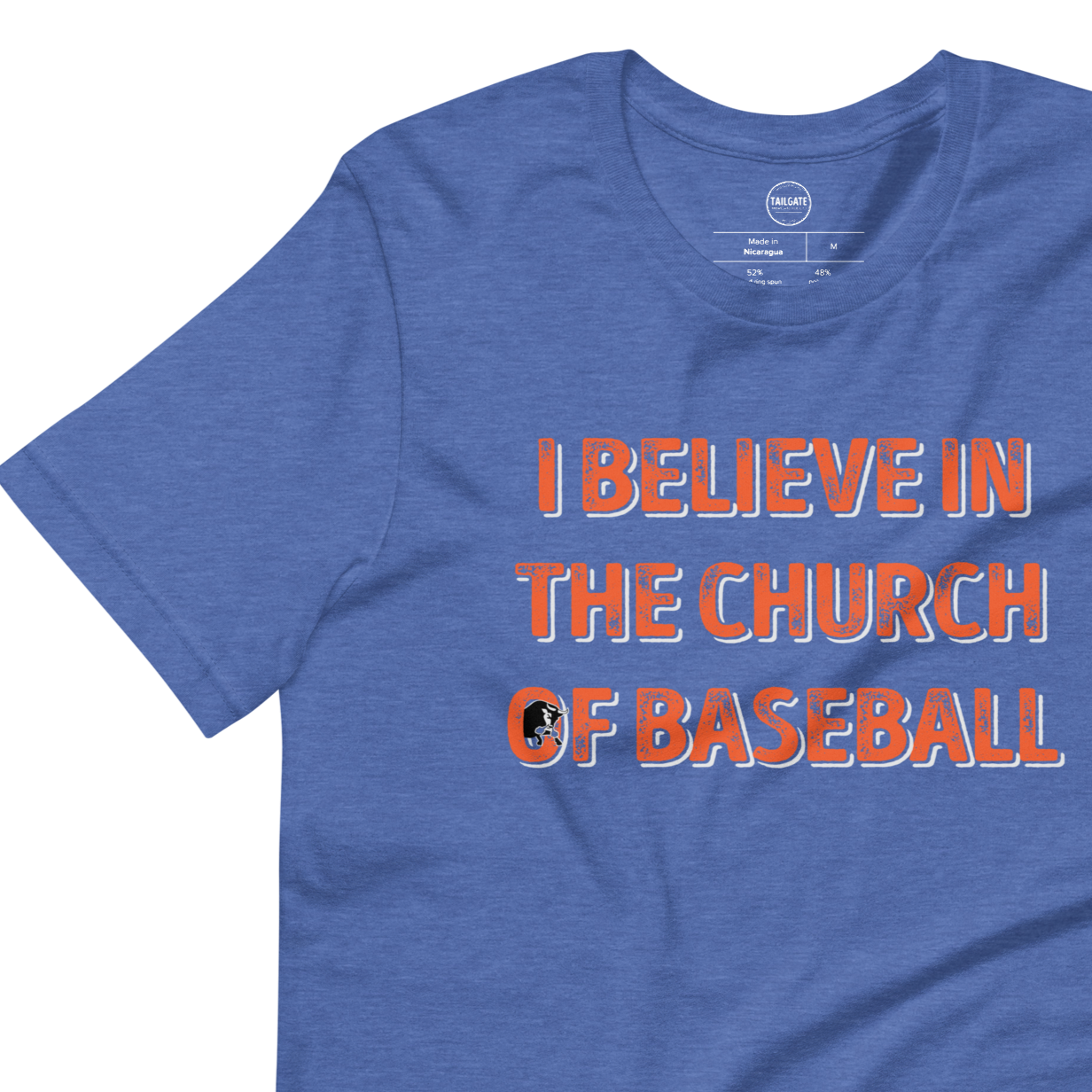 This image details the graphic design with the words "I believe in the church of baseball" with an image of a bull coming out of the O in "of". This shirt is an homage to the baseball movie Bull Durham featuring Kevin Costner and Susan Sarandon. This design is exclusive to Tailgate Mercantile and available only online.