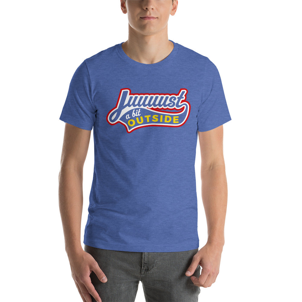 Image of young man wearing heather royal blue t-shirt with design of "Juuuust a bit Outside" in white/red/yellow located on centre chest. Just a Bit Outside is an homage to the great baseball movie "Major League". This design is exclusive to Tailgate Mercantile and available only online.