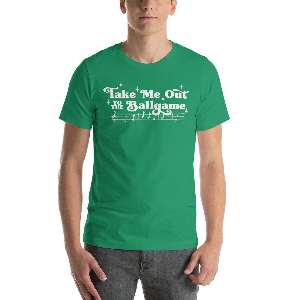 Image of man wearing kelly green t-shirt with design of "Take Me Out to the Ballgame" with coordinating musical notes in white located on centre chest. This design is exclusive to Tailgate Mercantile and available only online.
