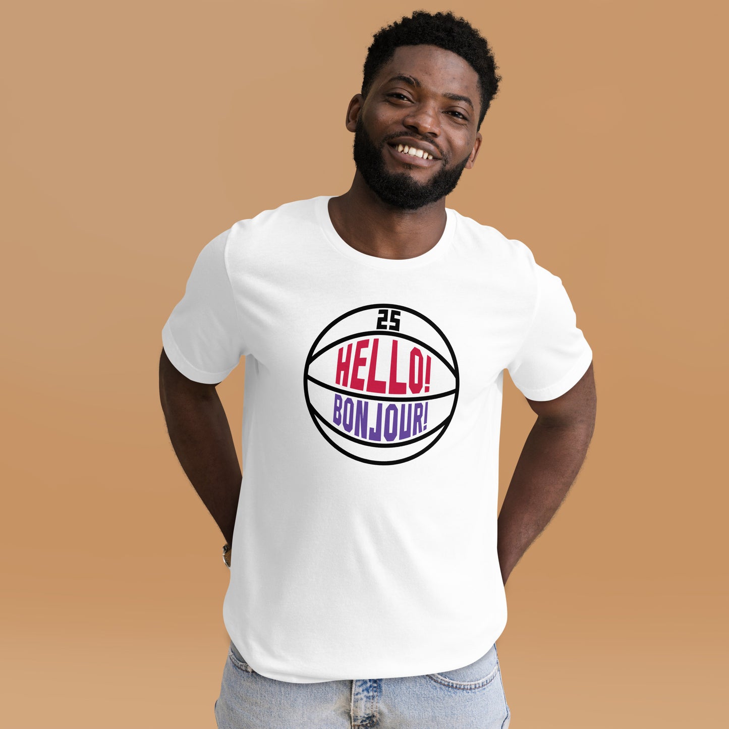 T-shirt worn by man, this image details the graphic design "Hello! Bonjour!". In the image, the words are built into a basketball and feature Chris Boucher's number 25. The Toronto Raptors' announcer, Jack Armstrong, loves to shout out Hello! Bonjour! when Chris Boucher does something exciting on the court. The tee is white and the design is black/red/purple similar to the Toronto Raptors retro colours. This item is exclusive to tailgate mercantile and is available only online.