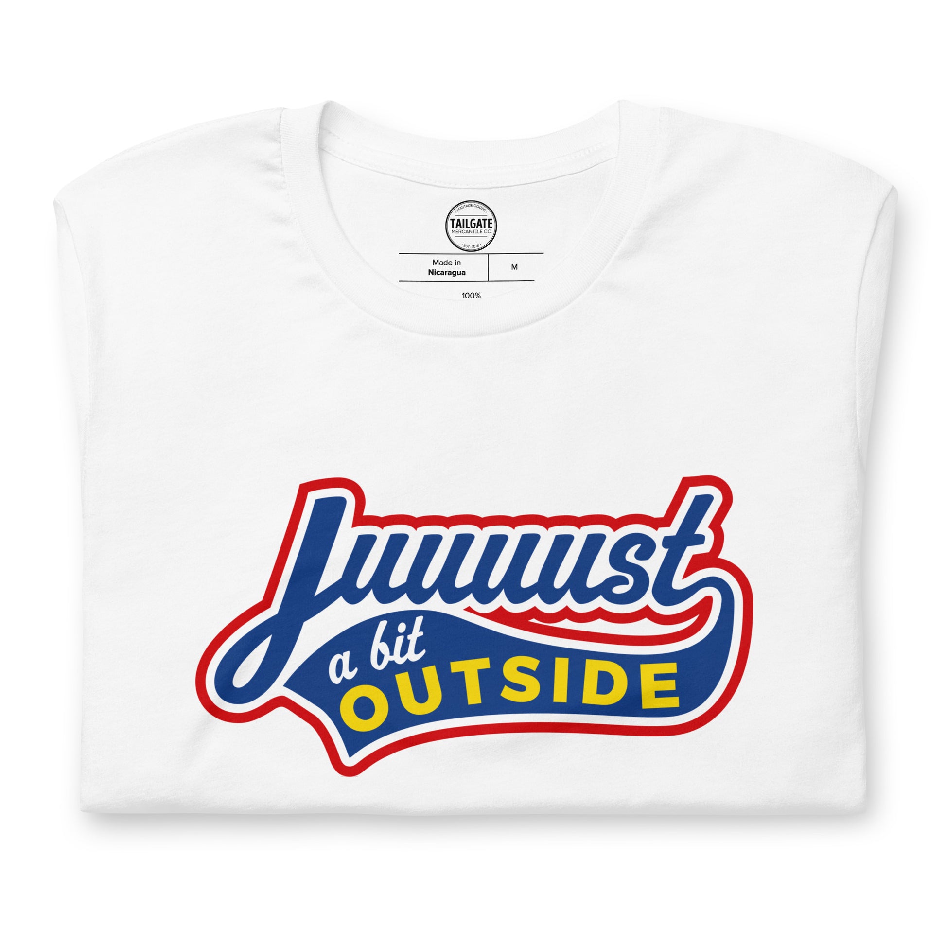 Close up image of white t-shirt with design of "Juuuust a bit Outside" in blue/red/yellow located on centre chest. Just a Bit Outside is an homage to the great baseball movie "Major League". This design is exclusive to Tailgate Mercantile and available only online.