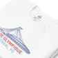 Close up image of white t-shirt with design of "Stade Olympique, Montreal, PQ" illustrated ballpark completed in retro Montreal Expos colours located on centre chest. Image includes neck tag information. This design is exclusive to Tailgate Mercantile and available only online.
